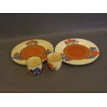 A pair of Clarice Cliff crocus pattern bread plates, and a similar pair of egg cups