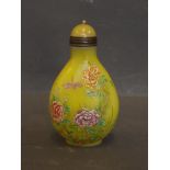 A Peking yellow ground glass snuff bottle painted with coloured enamels depicting insects and