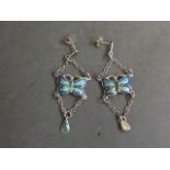 A pair of silver and enamel earrings in the form of butterflies