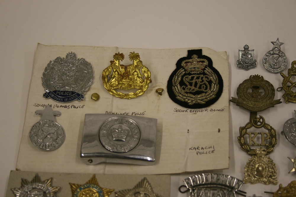 Selection of International Police Badges consisting of New Zealand Police belt buckle, Ceylon Police - Image 2 of 3