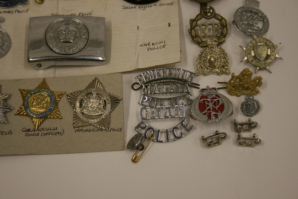 Selection of International Police Badges consisting of New Zealand Police belt buckle, Ceylon Police - Image 3 of 3