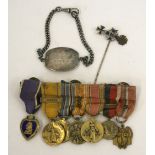 WW2 American Purple Heart Miniature Medal Group of Seven, mounted onto a medal bar. Group consists