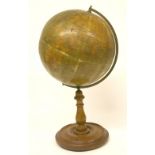 Early 20th Century Phillips 12 inch Terrestrial Globe on turned mahogany stand with brass arch.