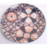 Early Japanese Imari Charger decorated with floral and insects design. Early Victorian period