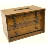 Portable Collectors Cabinet of polished wood with brass mounts to the edges. Complete with five