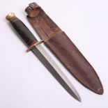 British Private Purchase Officers Combat Knife complete with the original leather scabbard. Blade