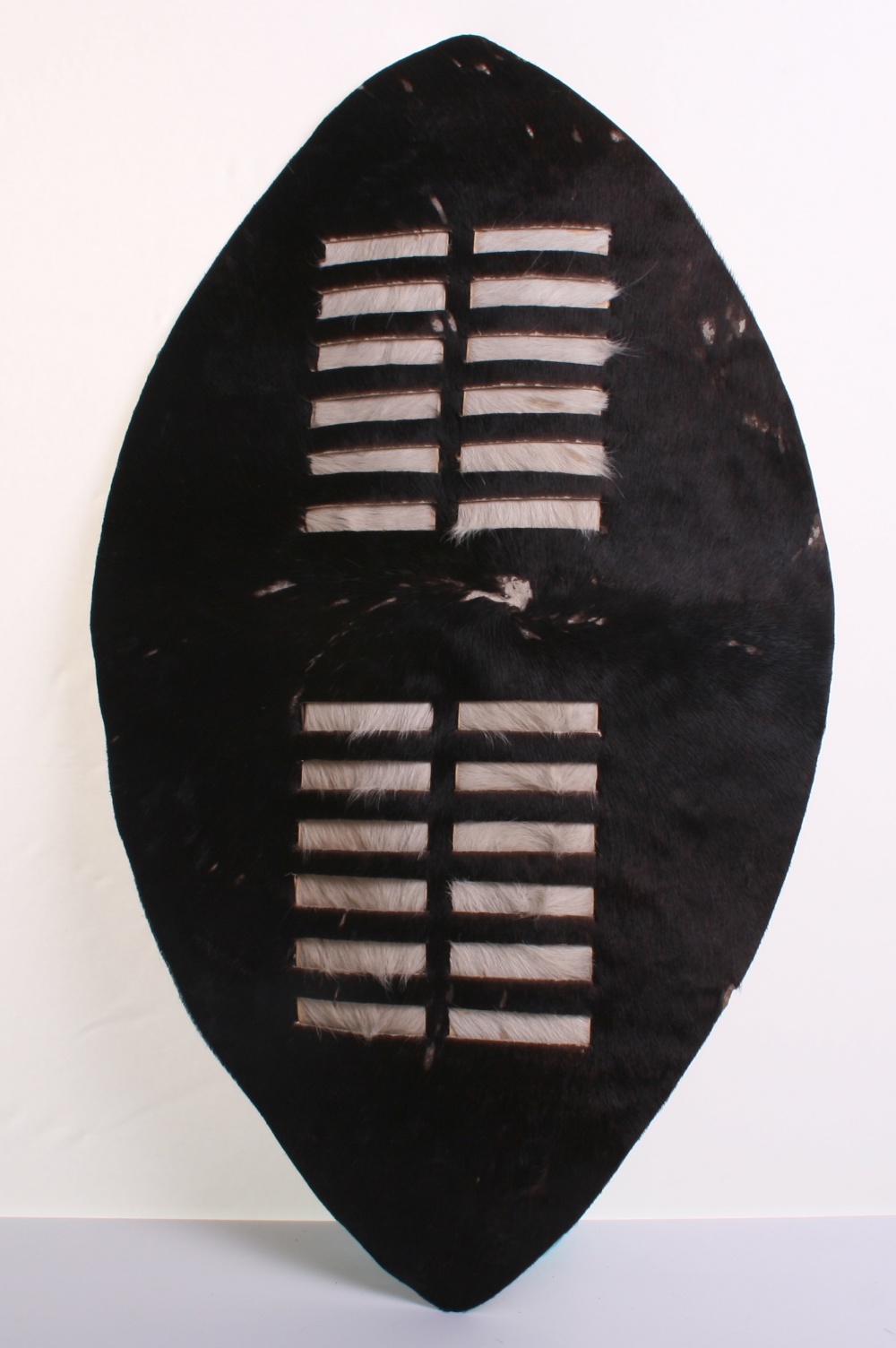 20th Century Zulu Shield, of animal hide with much of the original brown and white fur to the front.