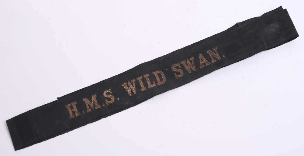 Royal Navy Cap Tally HMS WILD SWAN, gold wire embroidered on black ribbon. WW2 period example with