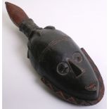 African Wooden Mask carved as a stylised human face, black painted with red details, elongated