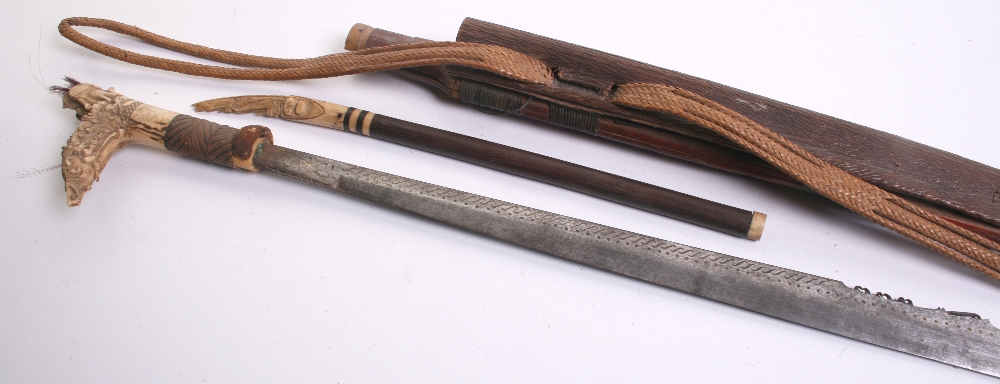 Borneo Head Hunter's Sword Mandau, 20th century, blade inlaid with long row of brass S-shaped