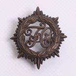 Scarce WW1 Women's Forage Corps Officers Cap Badge in bronze with two lug fittings on the reverse.