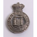 Victorian Dorsetshire Militia Glengarry Badge of white metal with three loops to the reverse. Centre