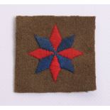 32nd Independent Guards Formation Sign, embroidered eight point star divided into red and blue on