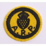 WW2 ARP Cornwall Cloth Badge being a yellow circle with black embroidered Cornwall crest and A.R.