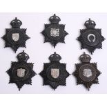 Six Kings Crown Police Helmet Plates, black stars, Caernarvonshire constabulary, East Riding of