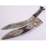 Indian kukri, blade 11", horn grip with brass mounts. In its silver mounted sheath with gold panel