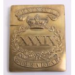 brass rectangular plate with pressed out wreath enclosing XXXIX and crown above. Top of the plate