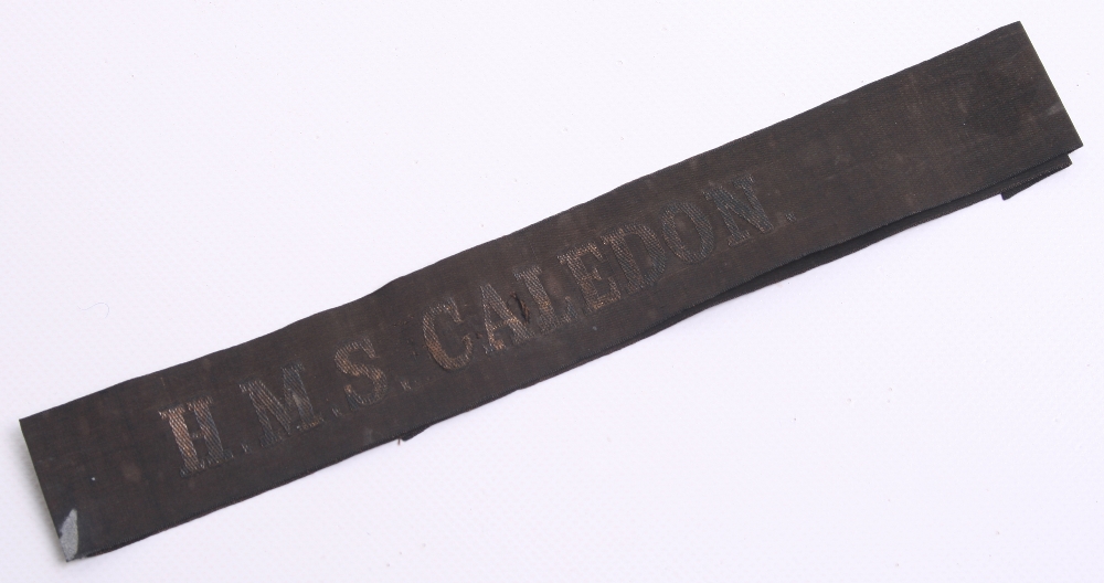 Great War HMS CALEDON Cap Tally with gold wire embroidered on black ribbon. Some fading and