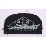 Royal Air Force Air Sea Rescue Arm Badge having embroidered launch boat with ASR. Paper residue on