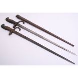 Two French Gras Bayonets, one complete with its original metal scabbard. Some staining and wear to