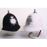 Two Brighton Police Helmets, Queens crown chrome helmet plate, chrome ball top, on white cork helmet