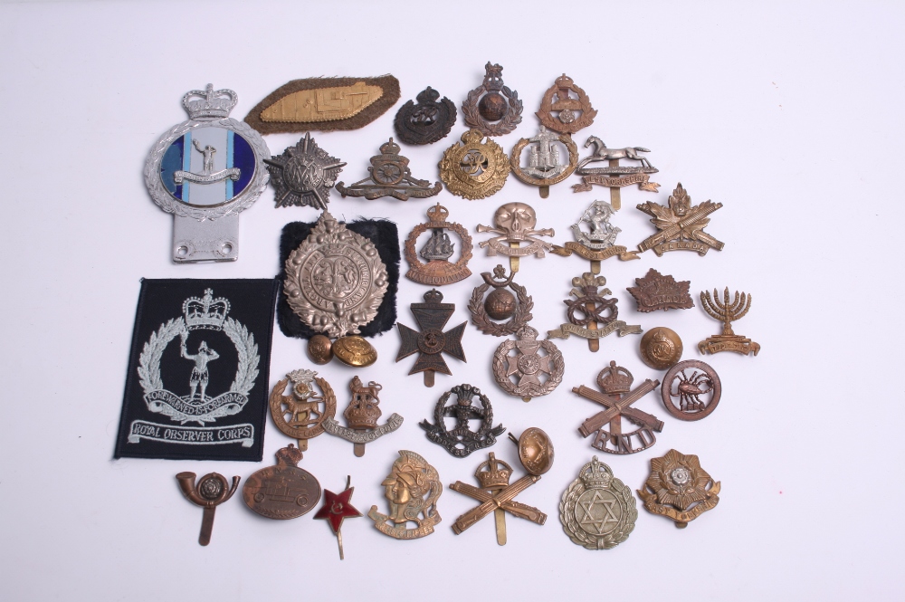 Selection of British Regimental Cap Badges of various regiments including East Yorkshire, York and