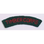 Scarce WW2 WLA Timber Corps Cloth Shoulder Title red embroidered lettering on green backing. Some