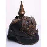 Imperial German 1860 Pattern Pickelhaube of leather body with brass fittings. Leather shell is