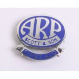 WW2 Home Front ARP Scott & Son Lapel Badge of chrome with blue enamel. Bottom of the badge has a
