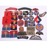 Selection of British Cloth Insignia including printed ROYAL ULSTER RIFLES cloth shoulder title,