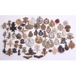 Selection of British Regimental Cap Badges of various regiments and periods including silvered