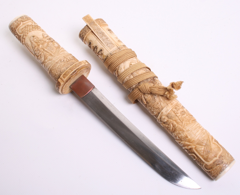 Japanese Carved Bone Dagger Tanto, blade 18.2cms (not tempered), hilt and sheath carved with various - Image 5 of 6