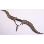 Indian Twin Bladed Weapon Haladie, 19th century, 27.75" overall, recurved blades, roped steel grips,