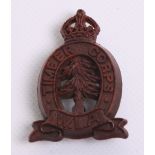 Scarce WW2 WLA Timber Corps Plastic Cap Badge complete with two blade fittings on the reverse.
