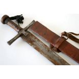 Sudanese Sword Kaskara complete with its original leather covered scabbard. Steel cross piece with