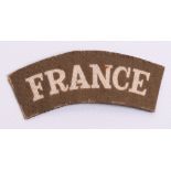 Scarce WW2 Printed FRANCE Nationality Shoulder Title, white lettering on khaki background. Worn by