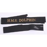 Royal Navy HMS DOLPHIN Cap Tally with gold wire embroidered on black ribbon. World War Two example