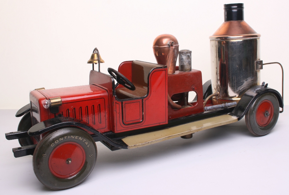 Large scale tinplate c/w Fire Pump with electric light, probably Bing circa 1920, finished in red