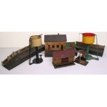 O gauge track side buildings and accessories, including Bing lithographed station with platform