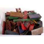 A Quantity Of Pre and Post War Meccano, blue,red and green components, wheels, pulleys ect, all in