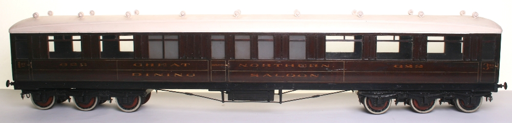 * Two 3 ¼” gauge wooden model Great Northern coaches, late 19th early 20th century, with cast iron