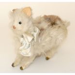 Fur covered wind-up cat, French circa 1910, the white rabbit skin cat with green glass eyes, card