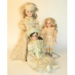 A.M 390 bisque head doll, with fixed brown glass eyes, open mouth and blonde wig, on a fully jointed