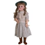 Good closed mouth J.D Kestner bisque head doll, German circa 1890, with weighted brown glass eyes,