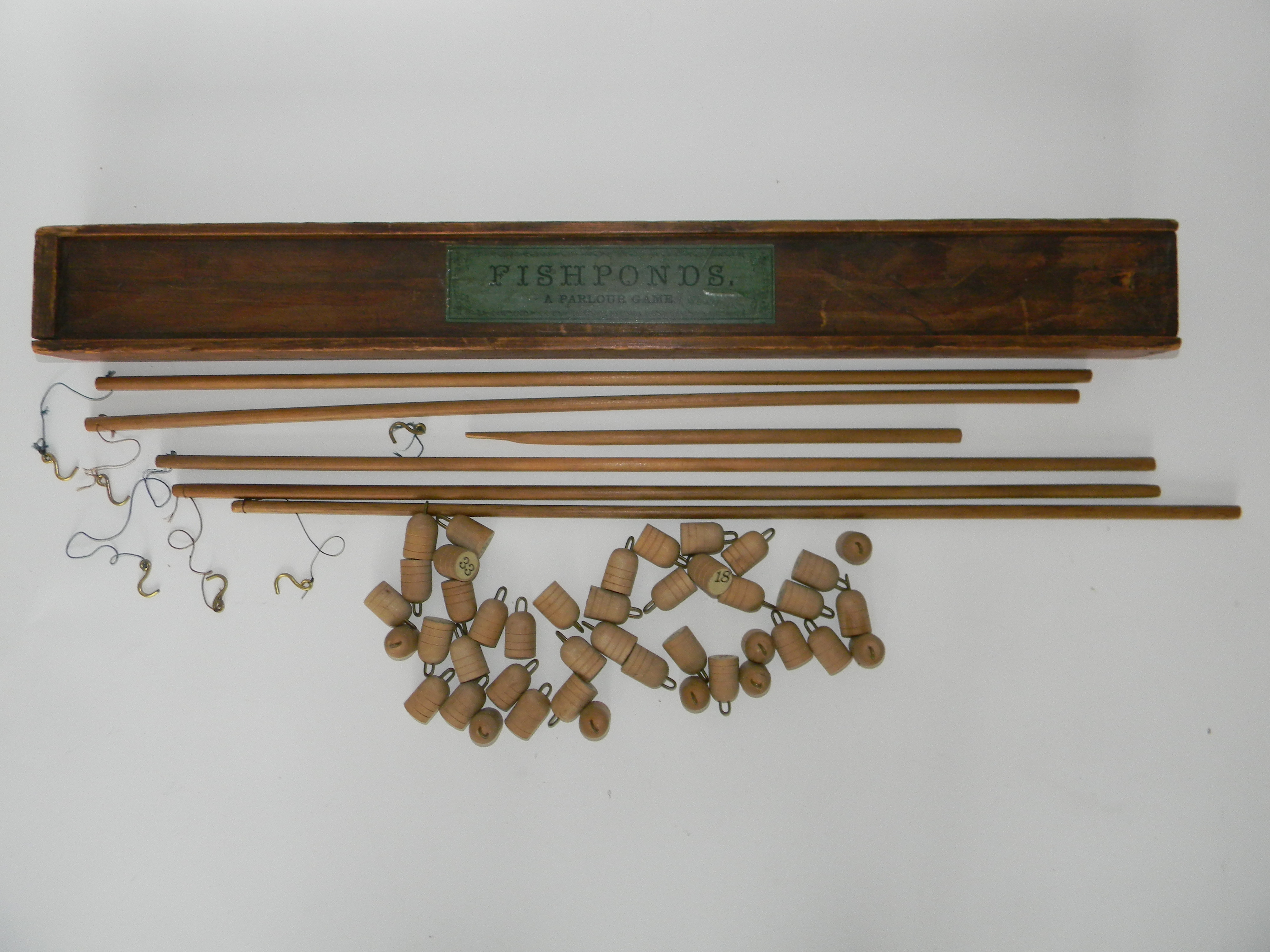 Fishponds, an early English Parlour game by Alfred Seeley, circa 1855, wooden box with sliding lid