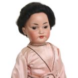Simon & Halbig 1129 bisque head oriental doll, German circa 1910, with weighted brown glass eyes,