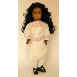 Simon & Halbig 1078 bisque head Mulatto doll, German circa 1910, with weighted brown glass eyes,