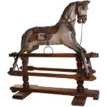 A G&J Lines Bros carved wooden rocking horse, English circa 1890, the dapple grey gesso horse with