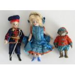 Pair of miniature all-bisque dolls and a monkey, the dolls with painted features, girl having swivel