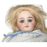 Simon & Halbig 950 bisque shoulder head doll, German 1870, with fixed blue glass eyes, feathered